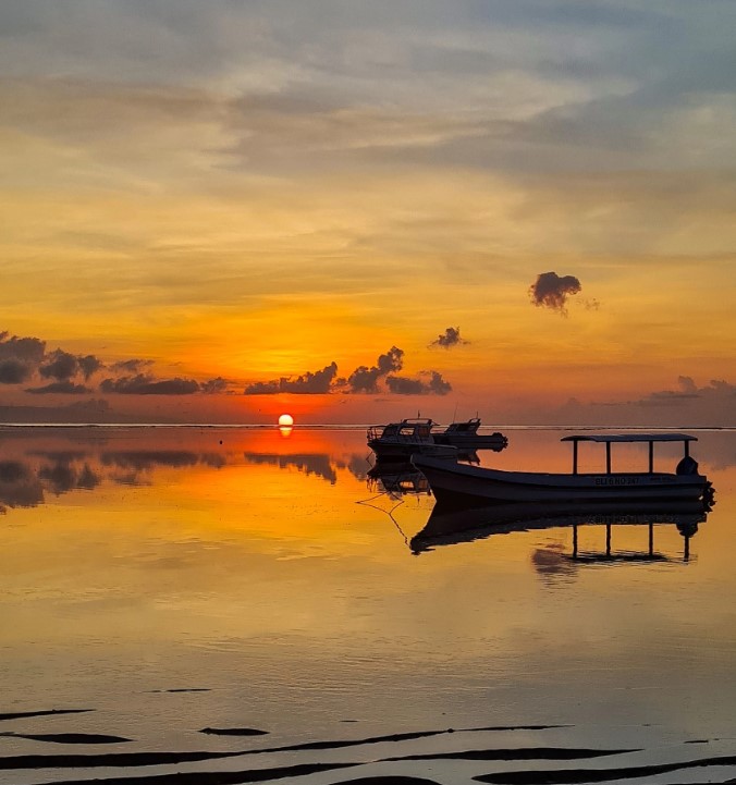 sunset sky by the water in sanur indonesia