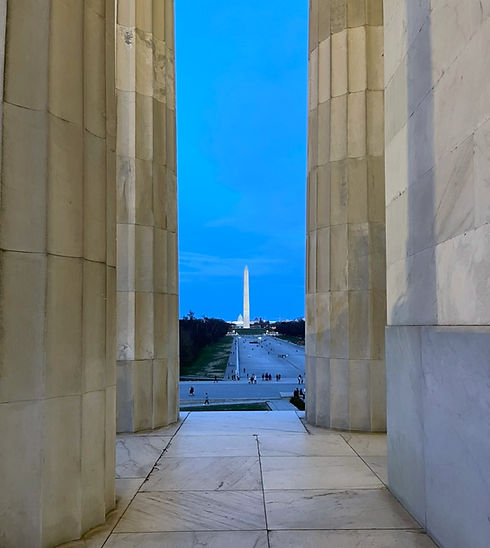 Lincoln Memorial Columns view of Obelisk at night
