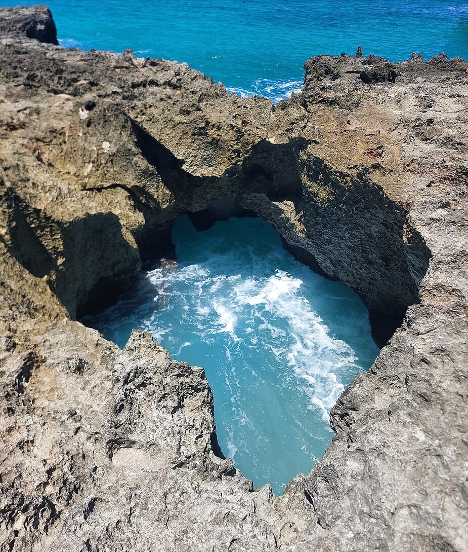 natural pool in a cave hole in the ocean